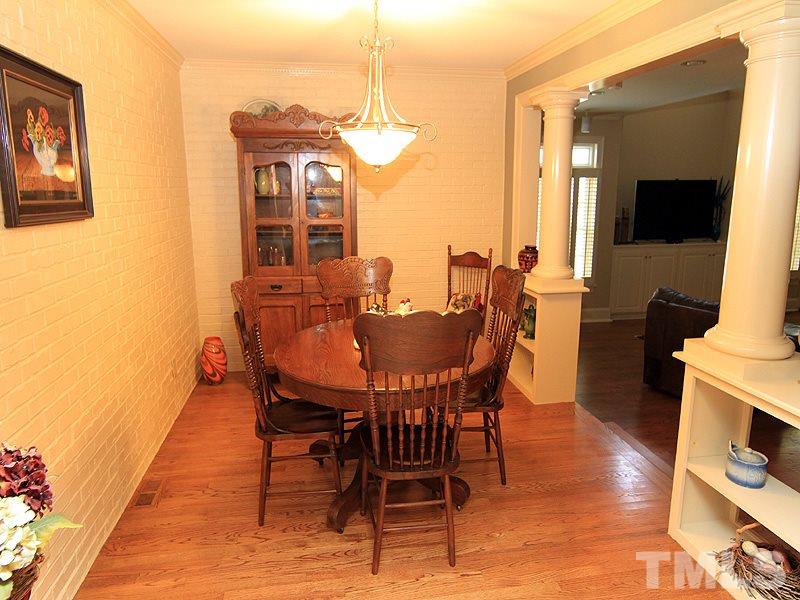 2204 Customs House Court Raleigh, NC 27615 - Photo 11 of 25 The breakfast room is cozy with a brick veneer wall, hardwoods and overlooks the recently added bonus/great room/family room.