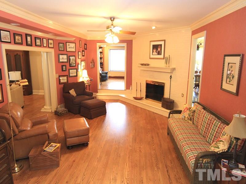 2204 Customs House Court Raleigh, NC 27615 - Photo 12 of 25 The original family room with wood fireplace with brick wall surround...(options in this home), hardwoods, moldings...so cozy