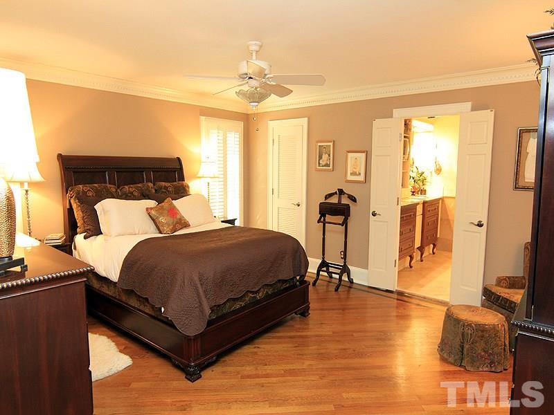 2204 Customs House Court Raleigh, NC 27615 - Photo 16 of 25 The master bedroom is tucked away on the first floor. Hardwood floors, moldings, walk-in closets, ceiling fan.