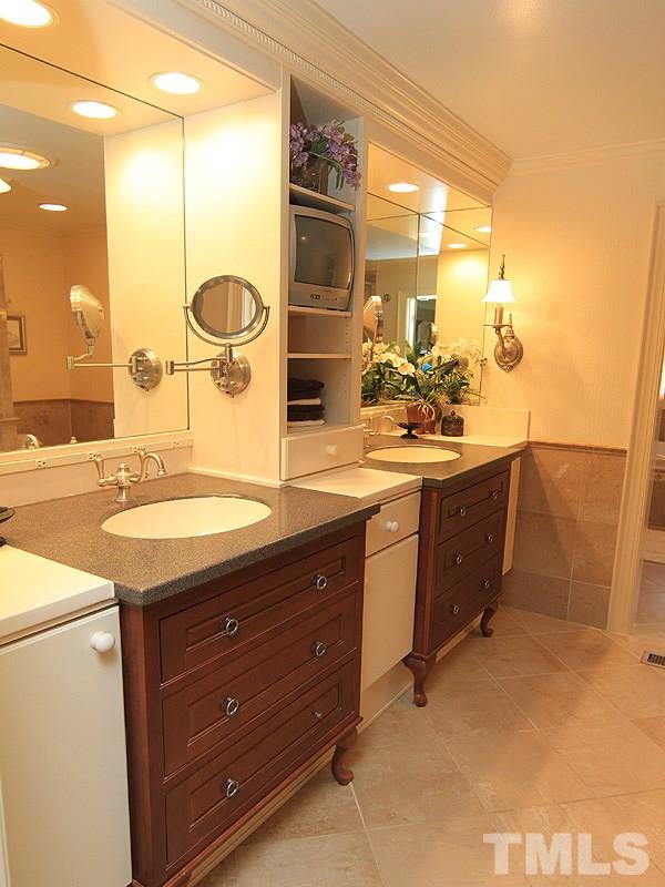 2204 Customs House Court Raleigh, NC 27615 - Photo 17 of 25 The his and her vanities are comfort height and there is lots of storage space here.
