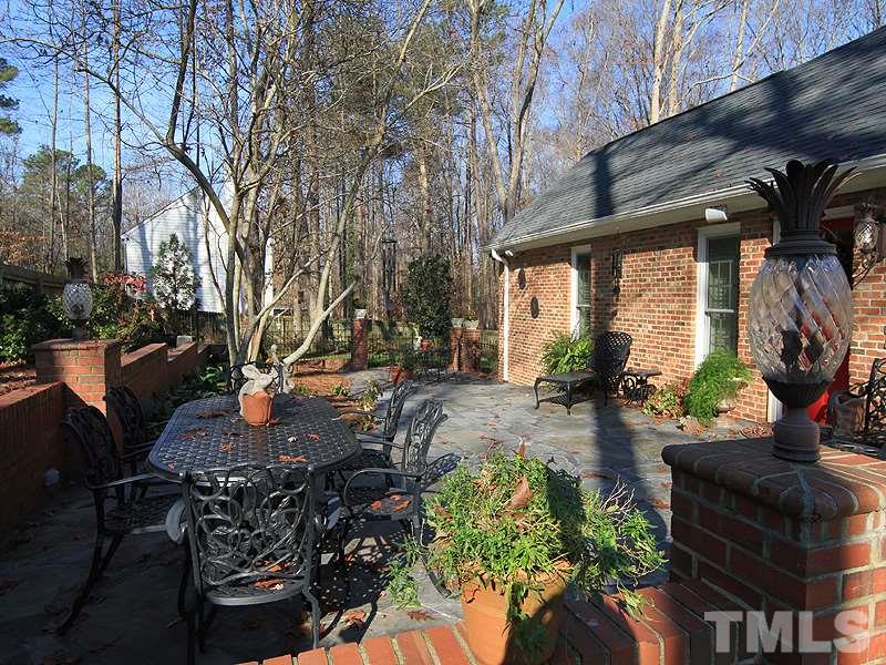 2204 Customs House Court Raleigh, NC 27615 - Photo 24 of 25 Outdoor relaxation and entertaining on this huge, stone patio with speakers for your listening pleasure.