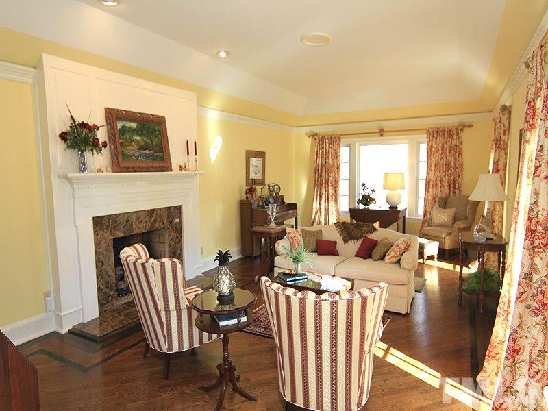 2204 Customs House Court Raleigh, NC 27615 - Photo 4 of 25 This living room is so not typical...room for sitting plus a piano, with a fireplace, magnificent molding & detail work, trey ceiling, hardwoods...with entrance to family room.