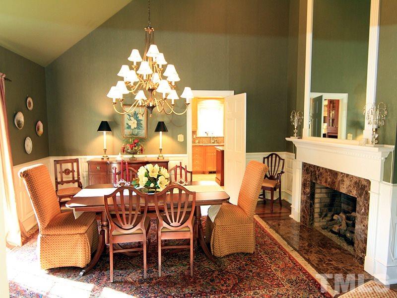 2204 Customs House Court Raleigh, NC 27615 - Photo 5 of 25 The formal dining room boasts a vaulted ceiling and another gas log fireplace.