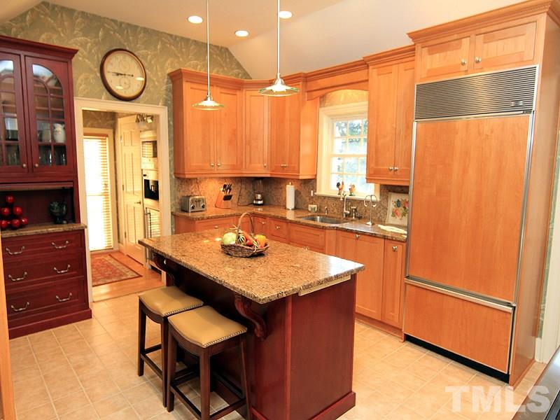 2204 Customs House Court Raleigh, NC 27615 - Photo 6 of 25 So much to tell about this gourmet kitchen w/ custom, flush cabinets...rollouts inside, granite, under cabinet lighting, huge deep sink, Sub Zero fridge, 6 burner Dacor Range, Miehle dishwasher - top-of-the line all the way. Organizers within cabinets.