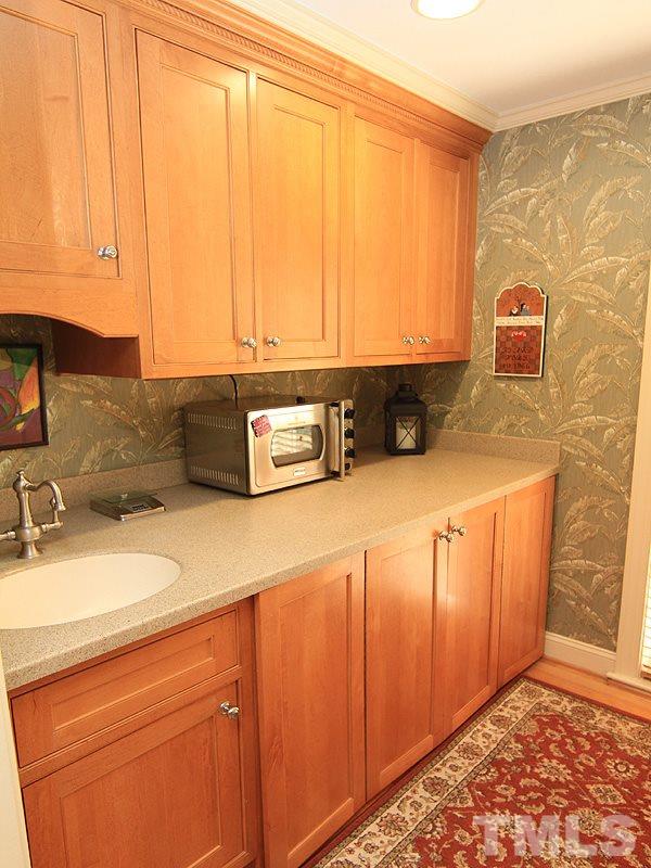 2204 Customs House Court Raleigh, NC 27615 - Photo 9 of 25 Rollout drawers behind the doors make it easy to reach all of your things. So much storage room...