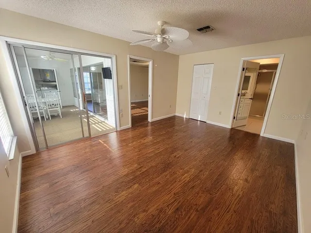 a view of a livingroom with wooden floor