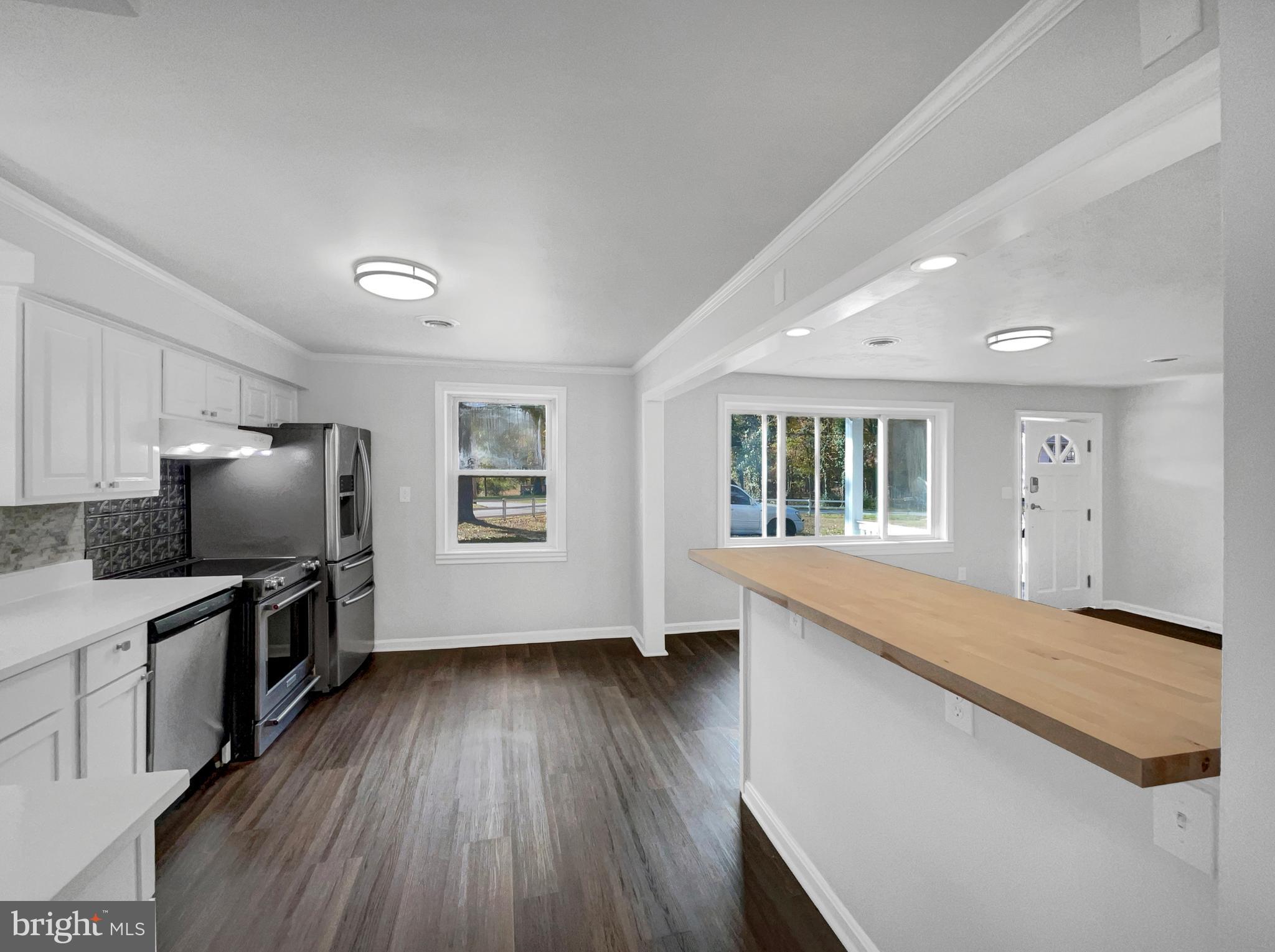 1101 Pine Lane Accokeek, MD 20607 - Photo 14 of 43 a view of flat screen tv and wooden floor