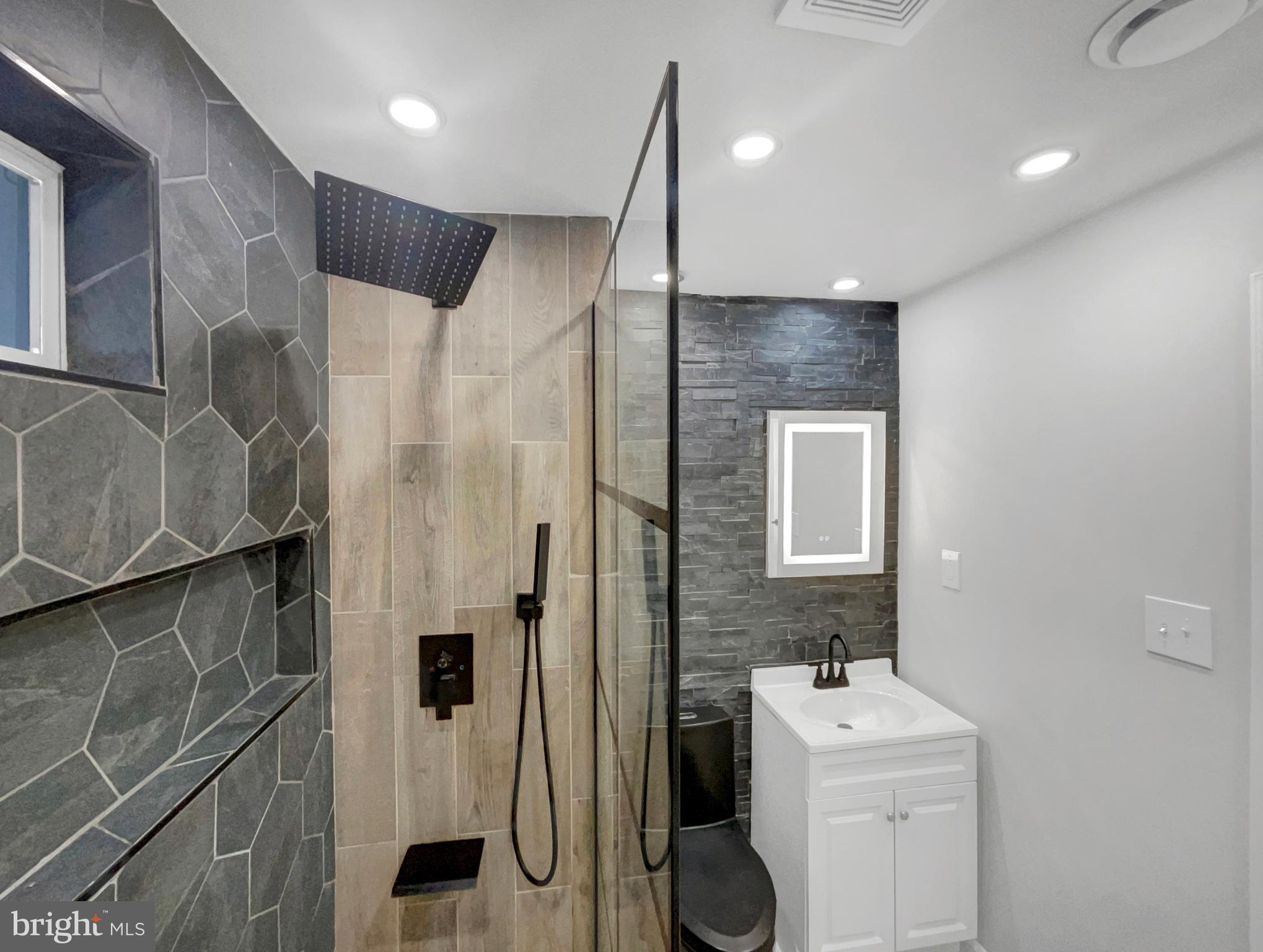 1101 Pine Lane Accokeek, MD 20607 - Photo 25 of 43 a bathroom with a shower and a sink