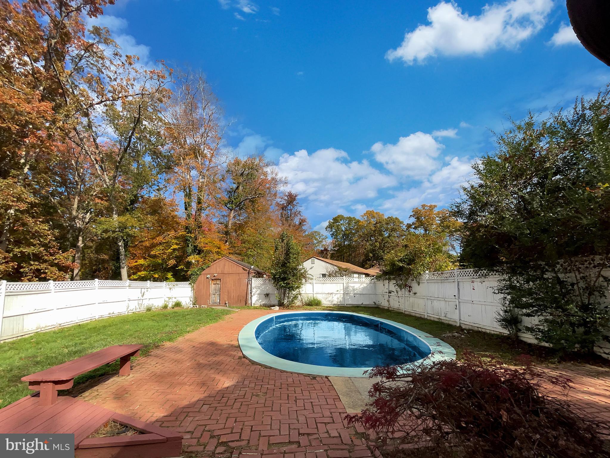 1101 Pine Lane Accokeek, MD 20607 - Photo 29 of 43 a view of a swimming pool with a yard