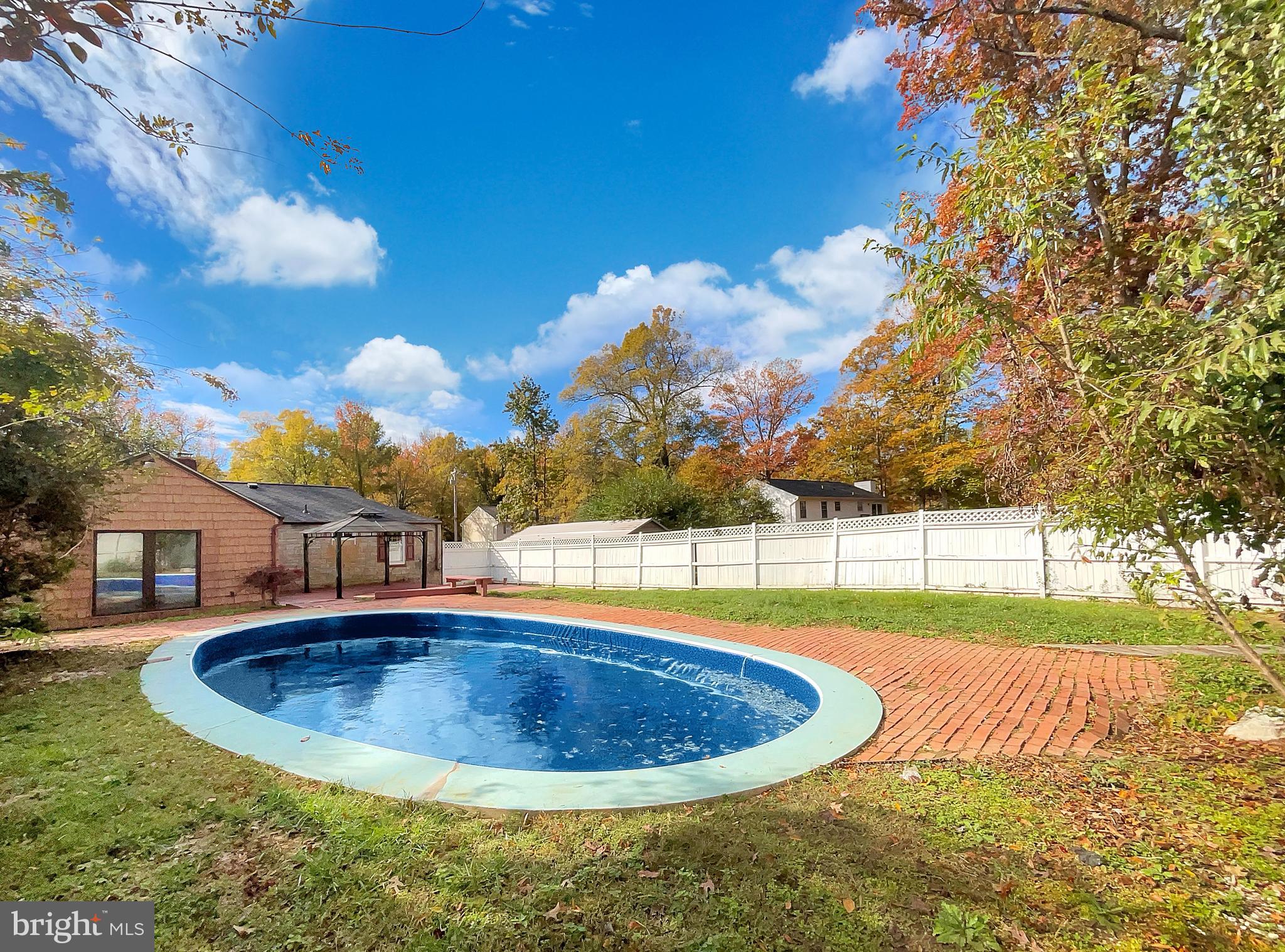 1101 Pine Lane Accokeek, MD 20607 - Photo 31 of 43 a view of a swimming pool with a yard