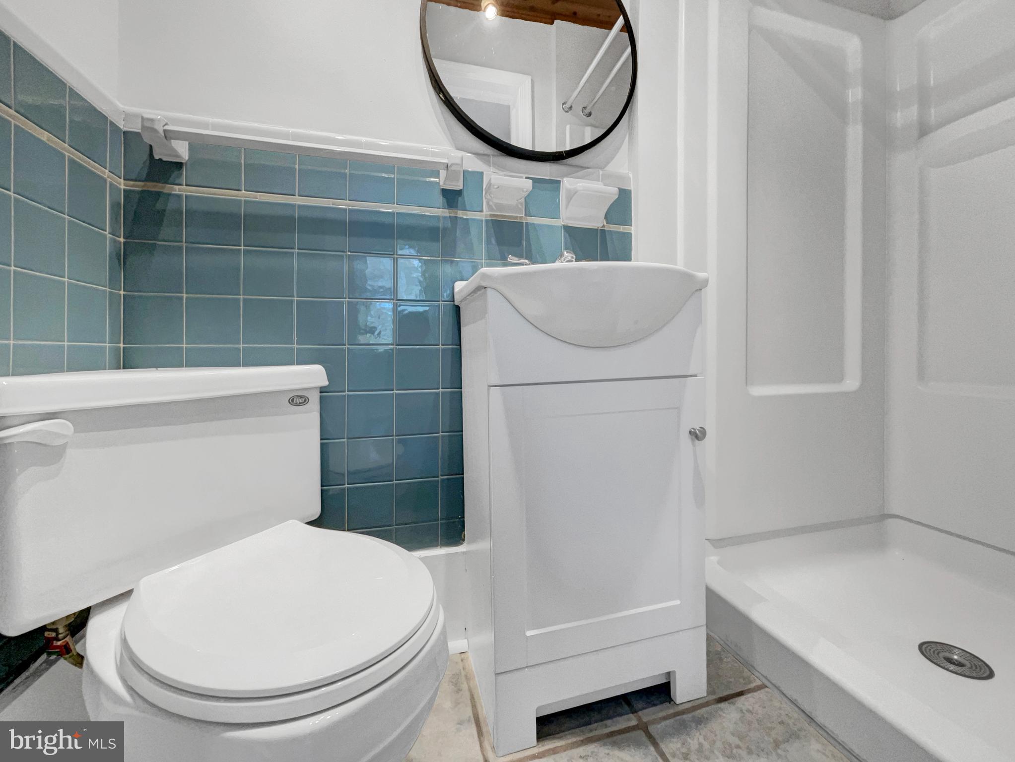 1101 Pine Lane Accokeek, MD 20607 - Photo 5 of 43 a bathroom with a toilet and a sink