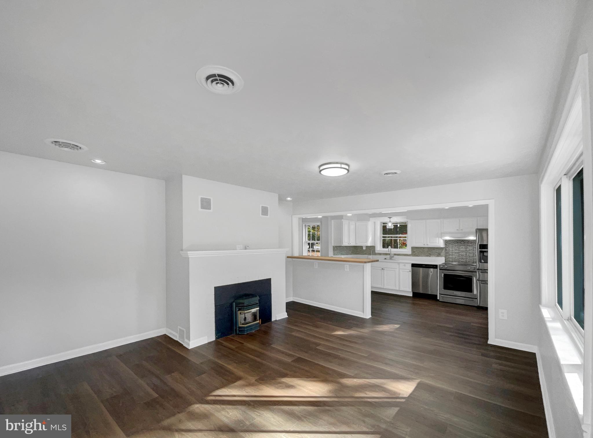 1101 Pine Lane Accokeek, MD 20607 - Photo 7 of 43 a living room with furniture and fireplace