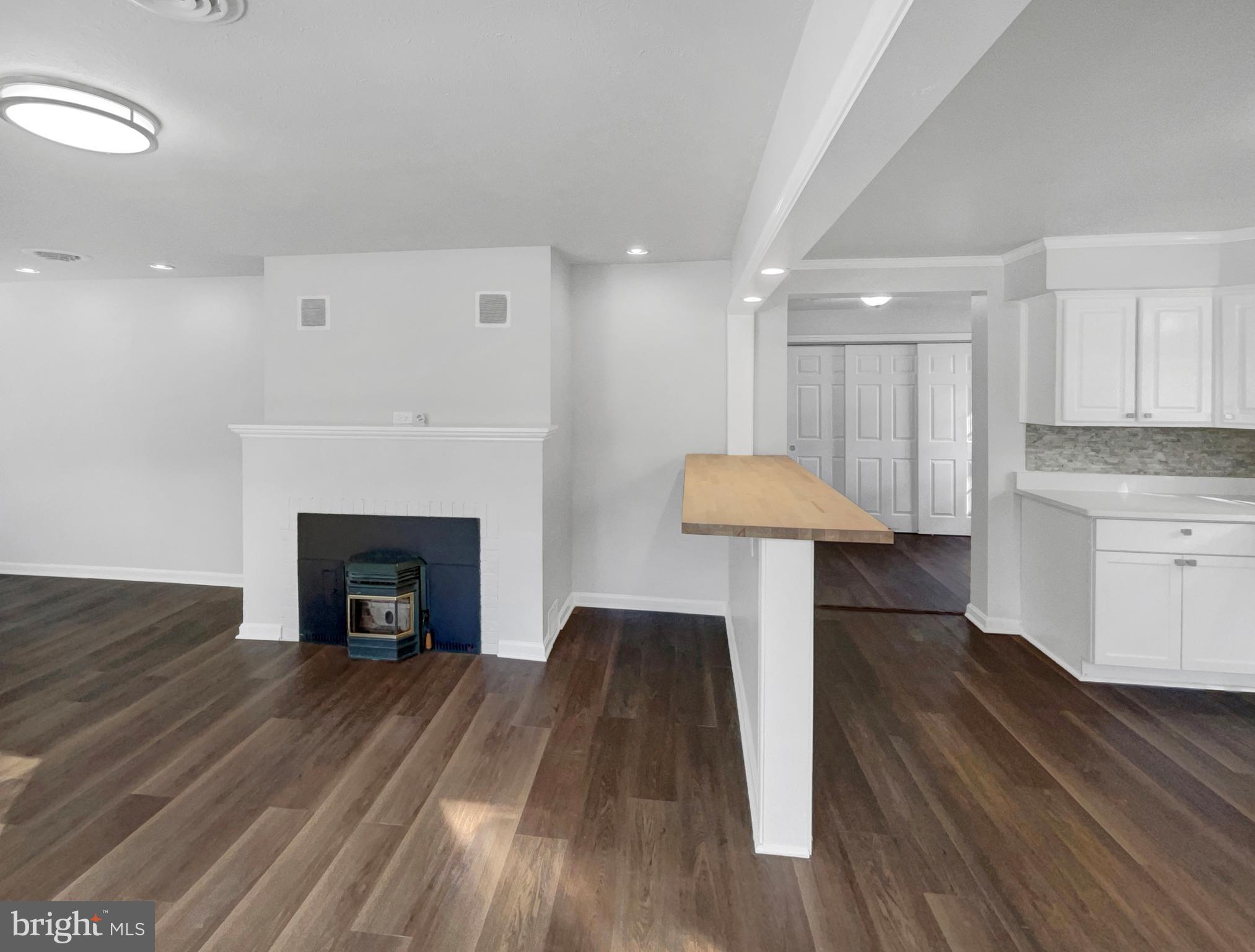 1101 Pine Lane Accokeek, MD 20607 - Photo 10 of 43 a living room with furniture and a fireplace