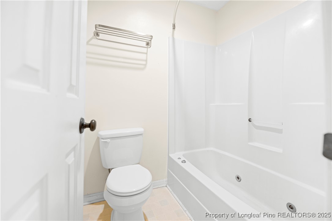 109 Ashton Place Spring Lake, NC 28390 - Photo 11 of 20 a bathroom with a toilet and a bathtub