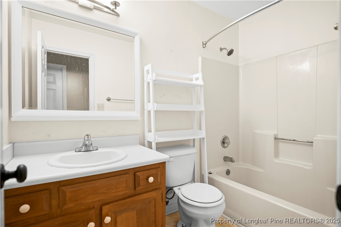 109 Ashton Place Spring Lake, NC 28390 - Photo 12 of 20 a bathroom with a sink a toilet and shower
