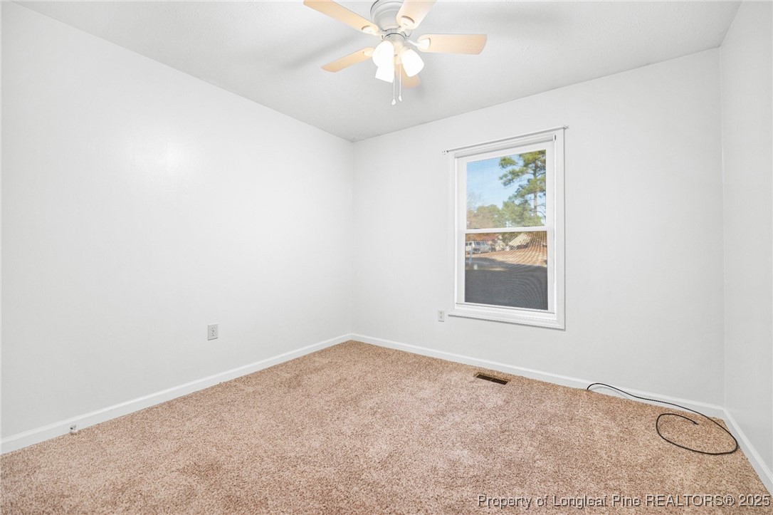 109 Ashton Place Spring Lake, NC 28390 - Photo 14 of 20 an empty room with a window and a fan