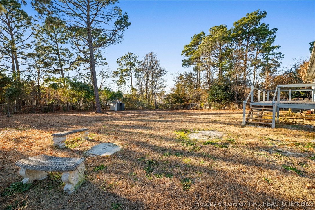 109 Ashton Place Spring Lake, NC 28390 - Photo 18 of 20 a backyard of a house with table and chairs