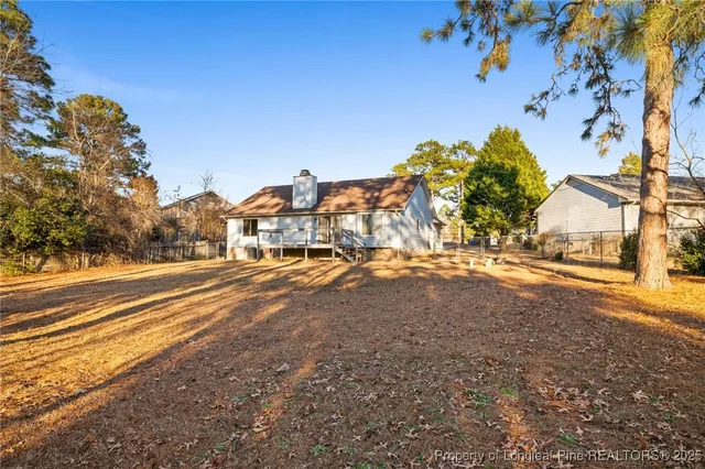 a view of road with large trees