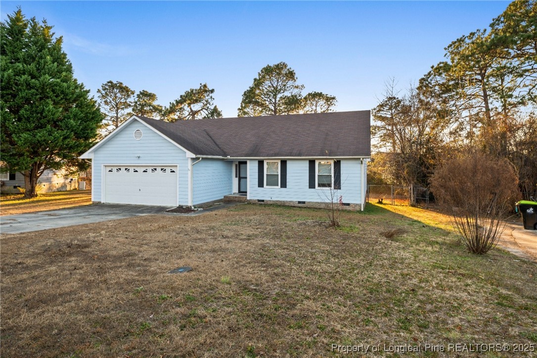 109 Ashton Place Spring Lake, NC 28390 - Photo 2 of 20 a house with trees in the background