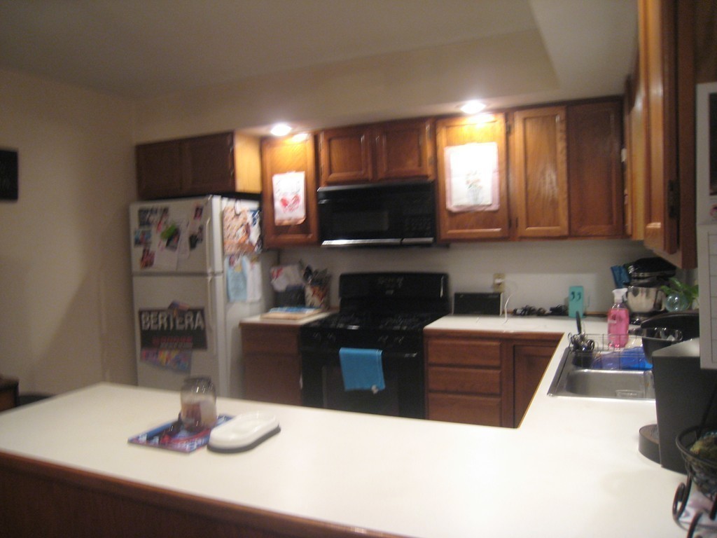 7 Ross Road Holyoke, MA 01040 - Photo 5 of 10 a kitchen with stainless steel appliances kitchen island granite countertop a refrigerator a stove top oven a sink and dishwasher