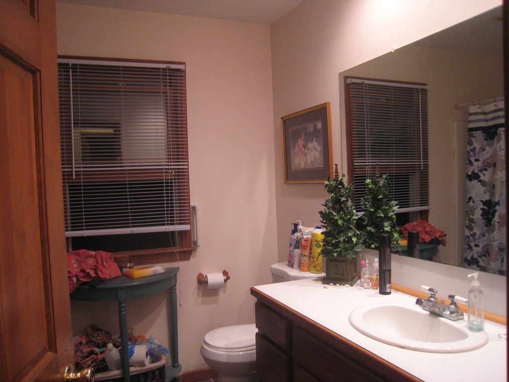 7 Ross Road Holyoke, MA 01040 - Photo 8 of 10 a bathroom with a sink toilet and mirror