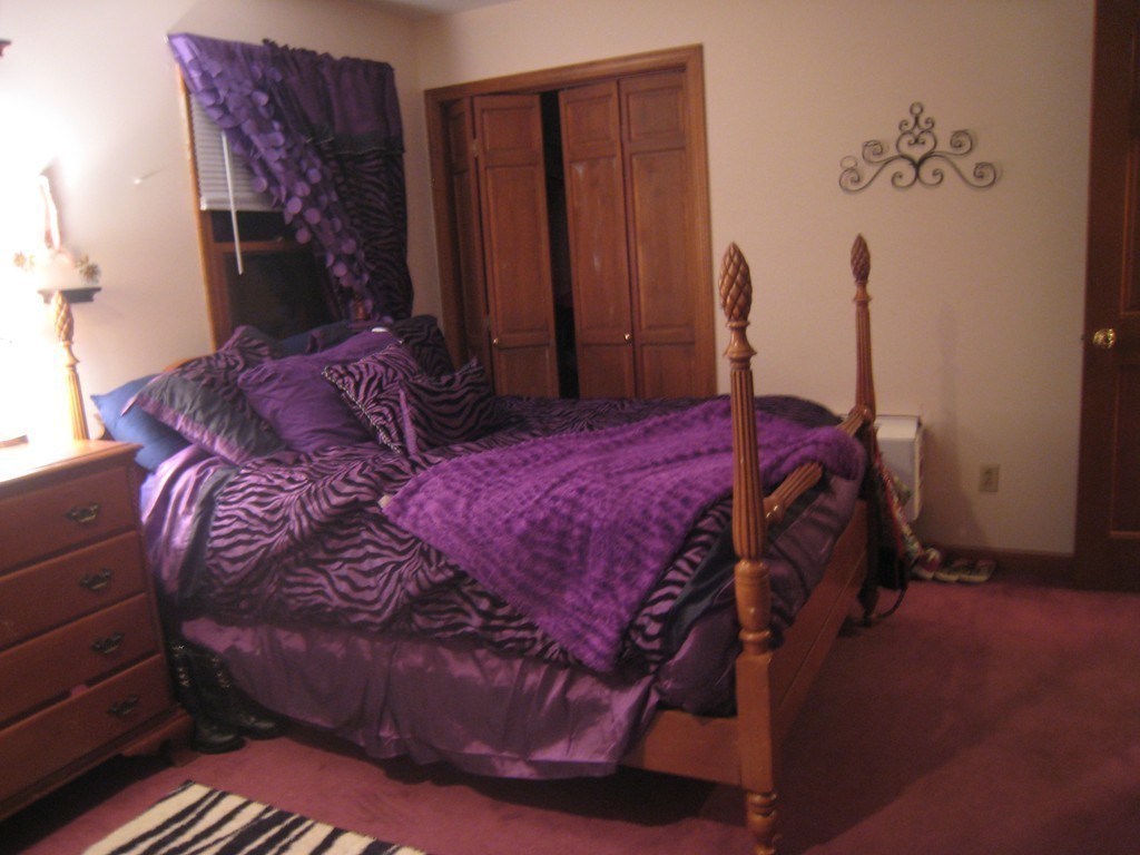 7 Ross Road Holyoke, MA 01040 - Photo 9 of 10 a bed sitting in a bedroom next to a window