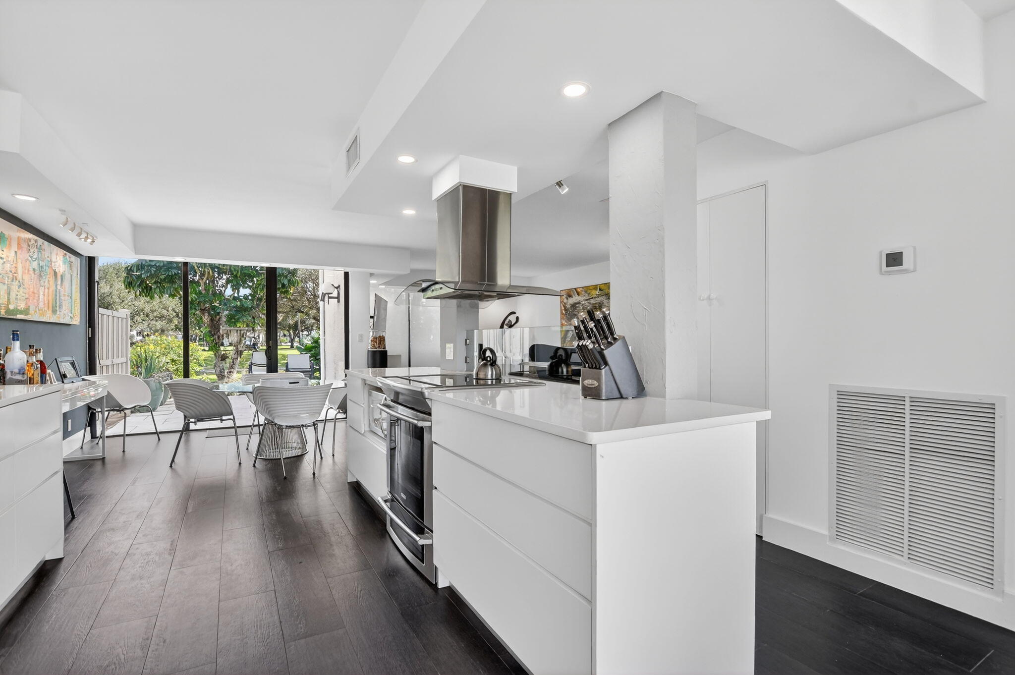 2306 Bridgewood Drive Boca Raton, FL 33434 - Photo 11 of 66 a kitchen with white cabinets and sink