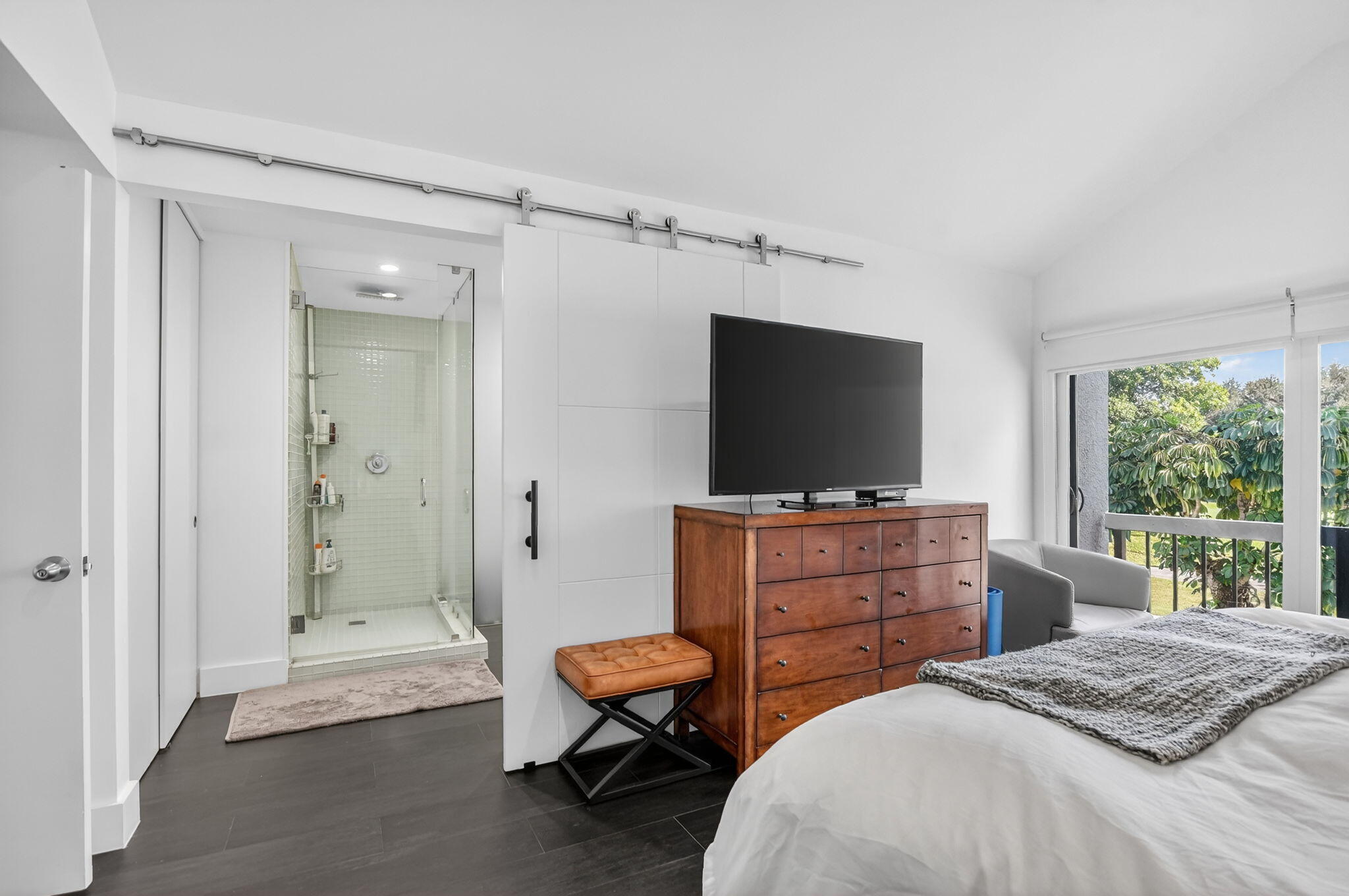 2306 Bridgewood Drive Boca Raton, FL 33434 - Photo 22 of 66 a bedroom with a bed and a flat screen tv