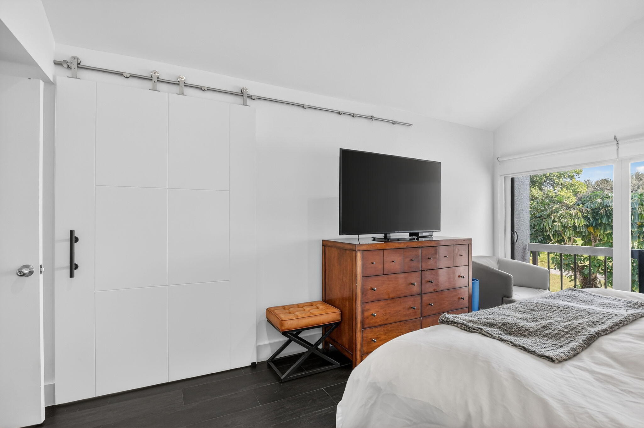 2306 Bridgewood Drive Boca Raton, FL 33434 - Photo 23 of 66 a bedroom with a bed and a flat screen tv