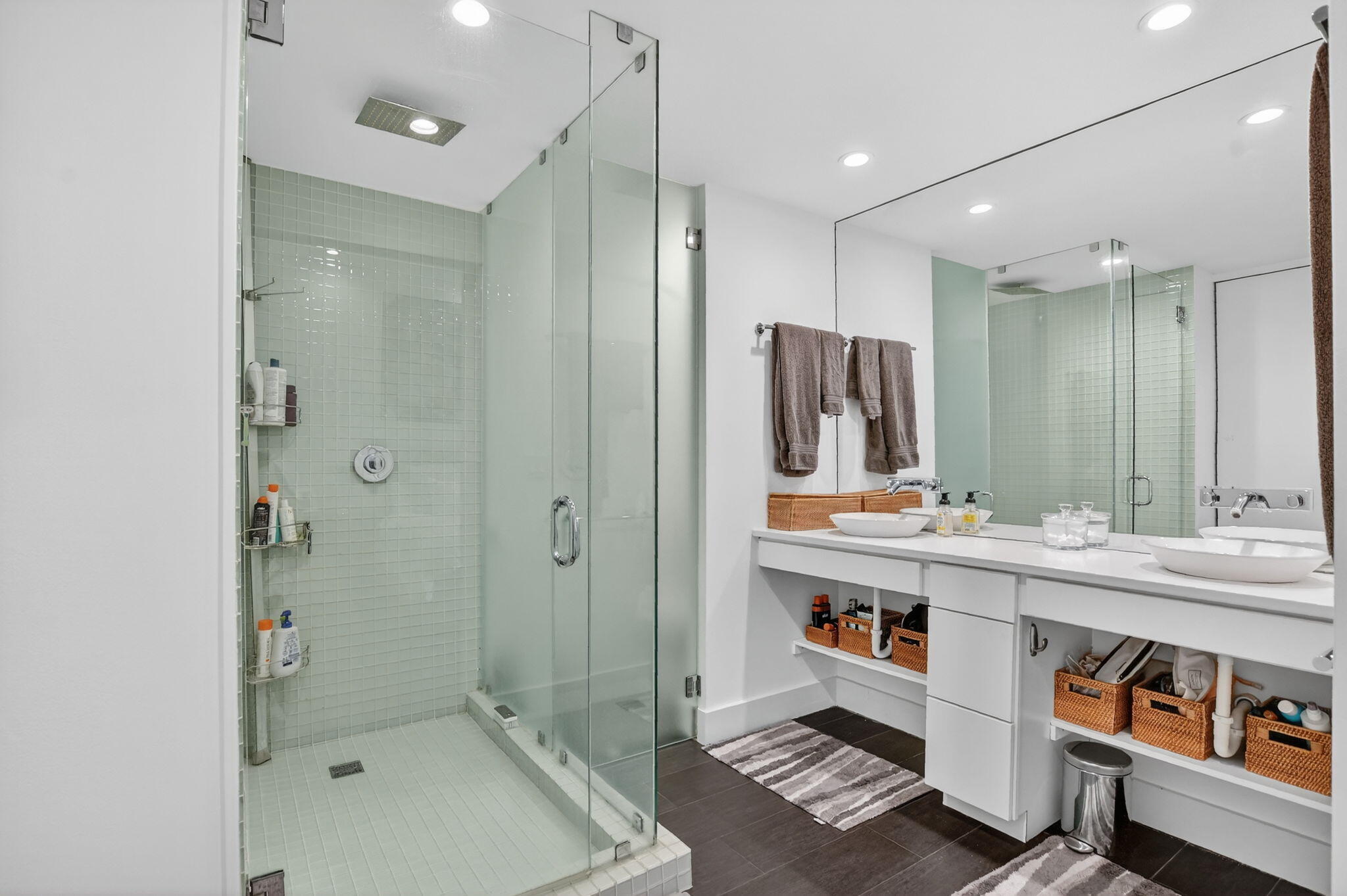 2306 Bridgewood Drive Boca Raton, FL 33434 - Photo 24 of 66 a bathroom with a double vanity sink a mirror and a shower