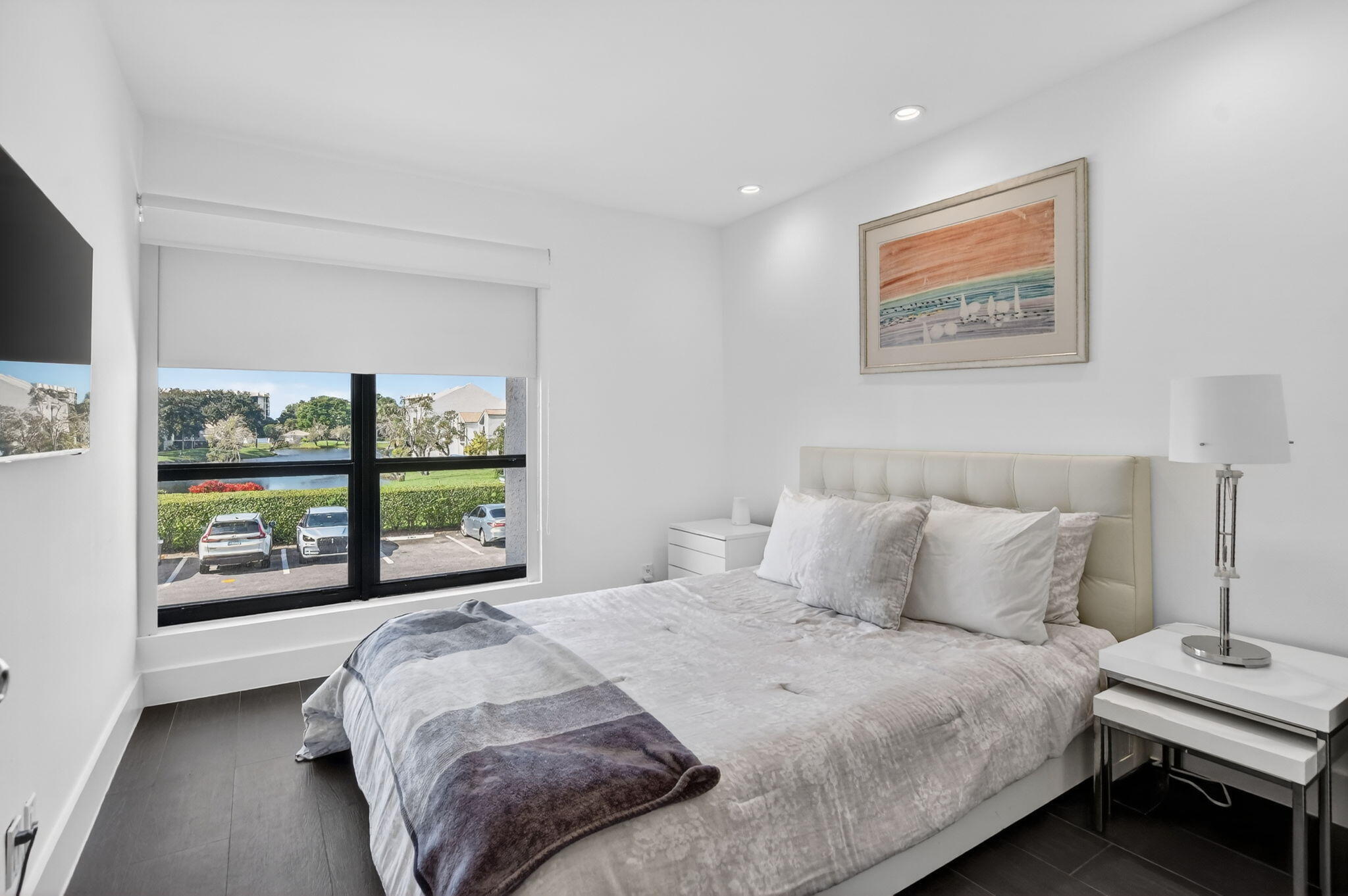 2306 Bridgewood Drive Boca Raton, FL 33434 - Photo 28 of 66 a bedroom with a bed and a large window