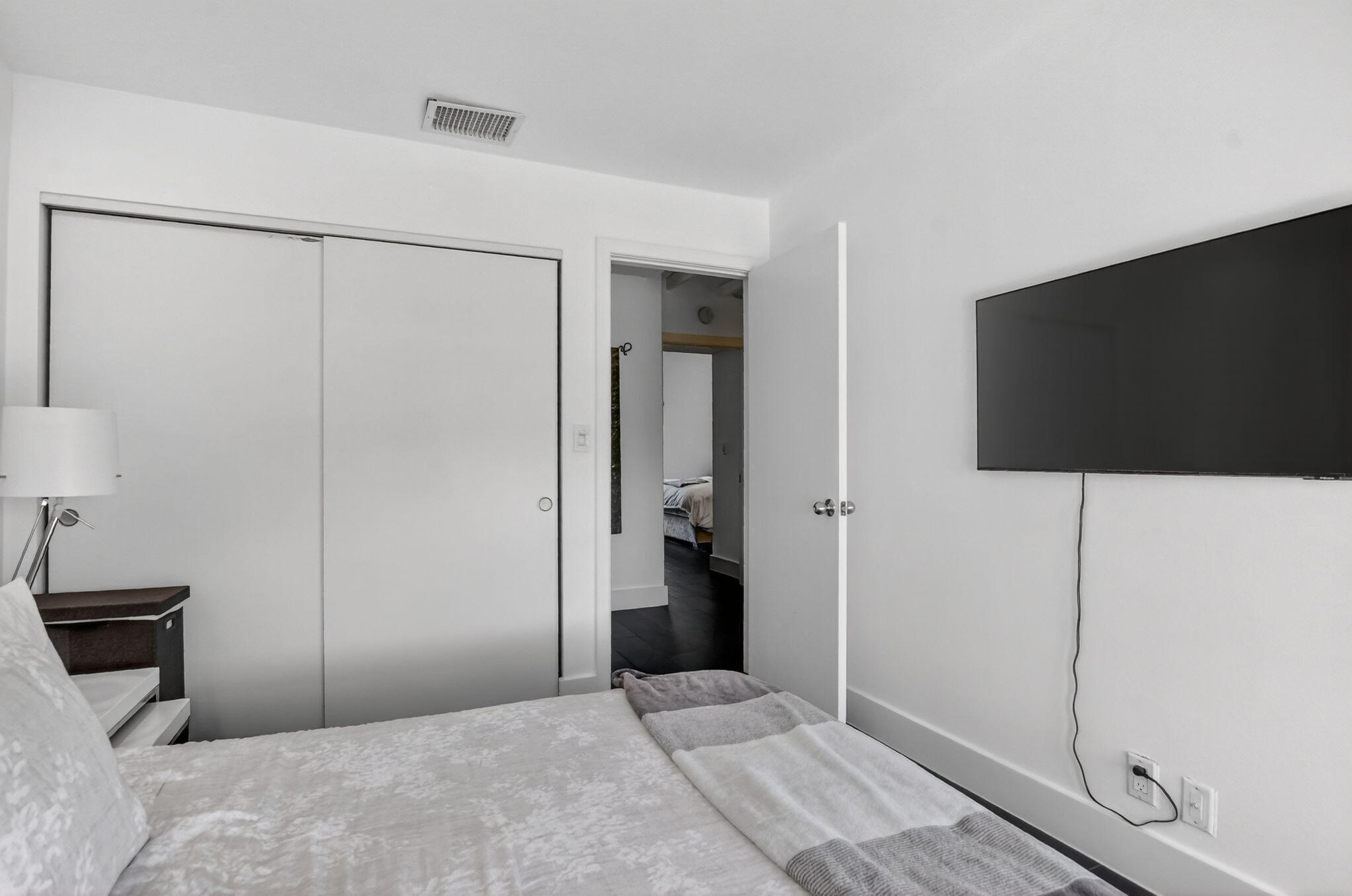 2306 Bridgewood Drive Boca Raton, FL 33434 - Photo 29 of 66 a bedroom with a bed and a flat screen tv