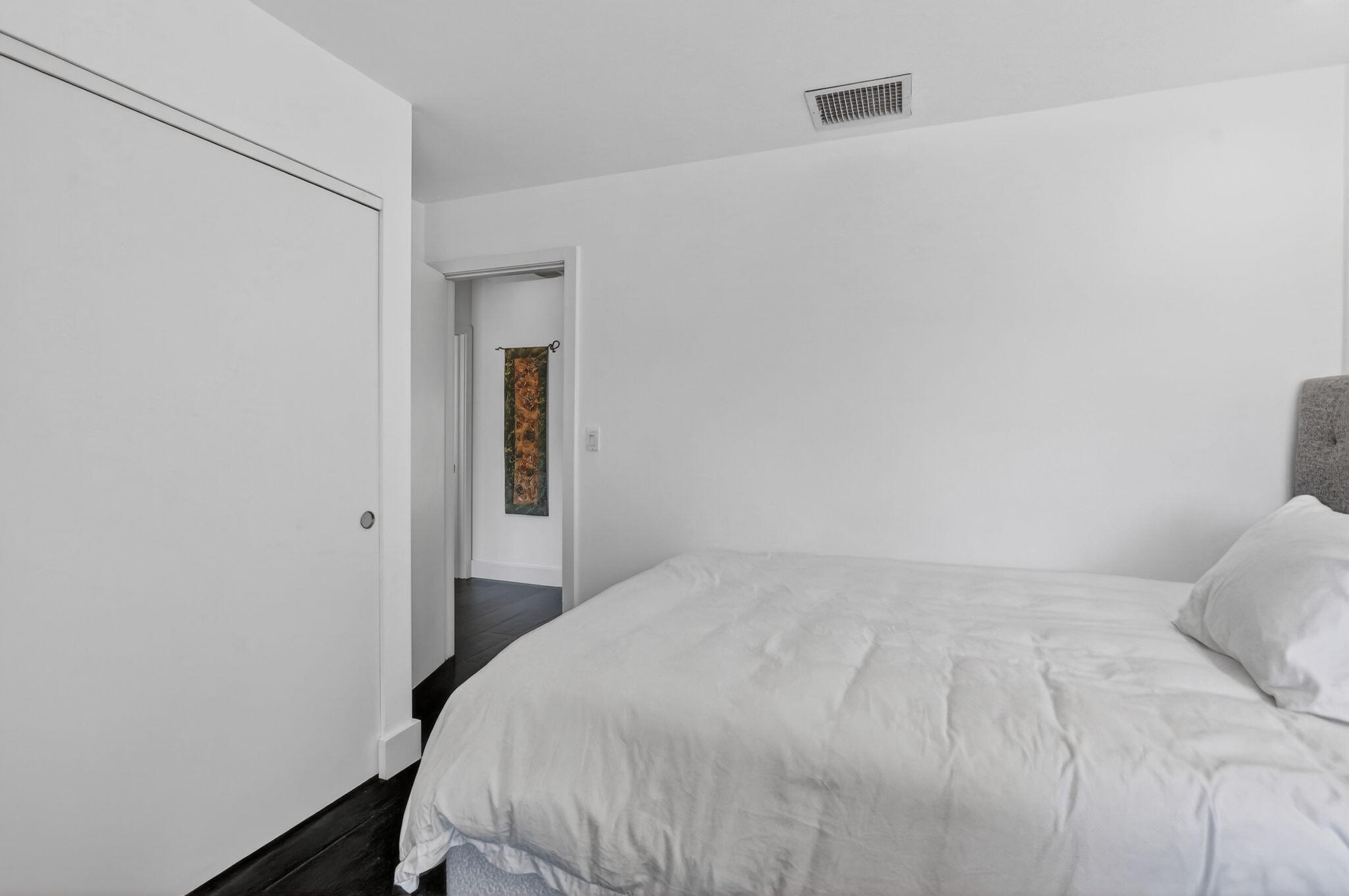 2306 Bridgewood Drive Boca Raton, FL 33434 - Photo 33 of 66 a bedroom with a bed and a mirror