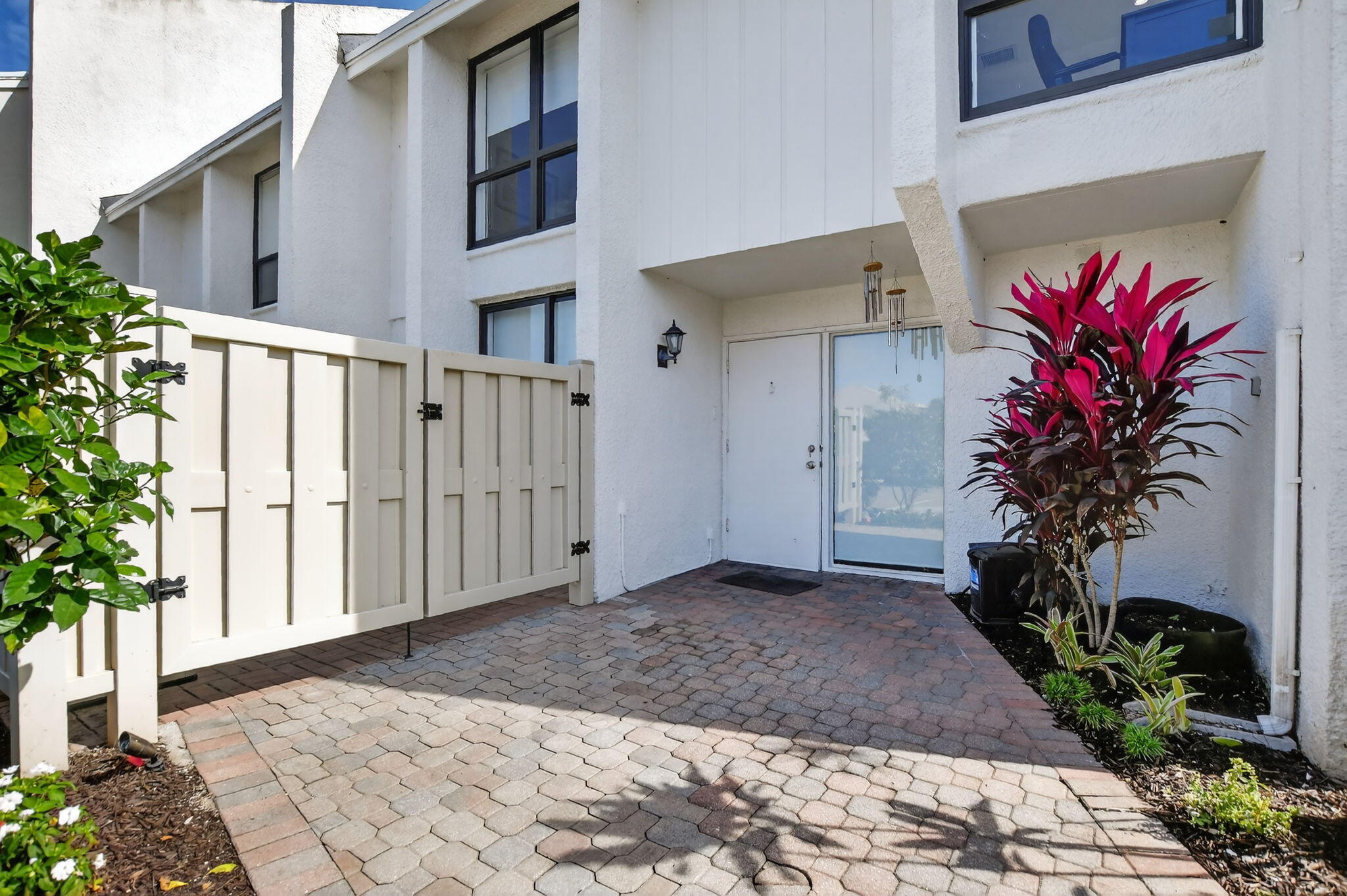 2306 Bridgewood Drive Boca Raton, FL 33434 - Photo 36 of 66 a view of a house with a flower garden