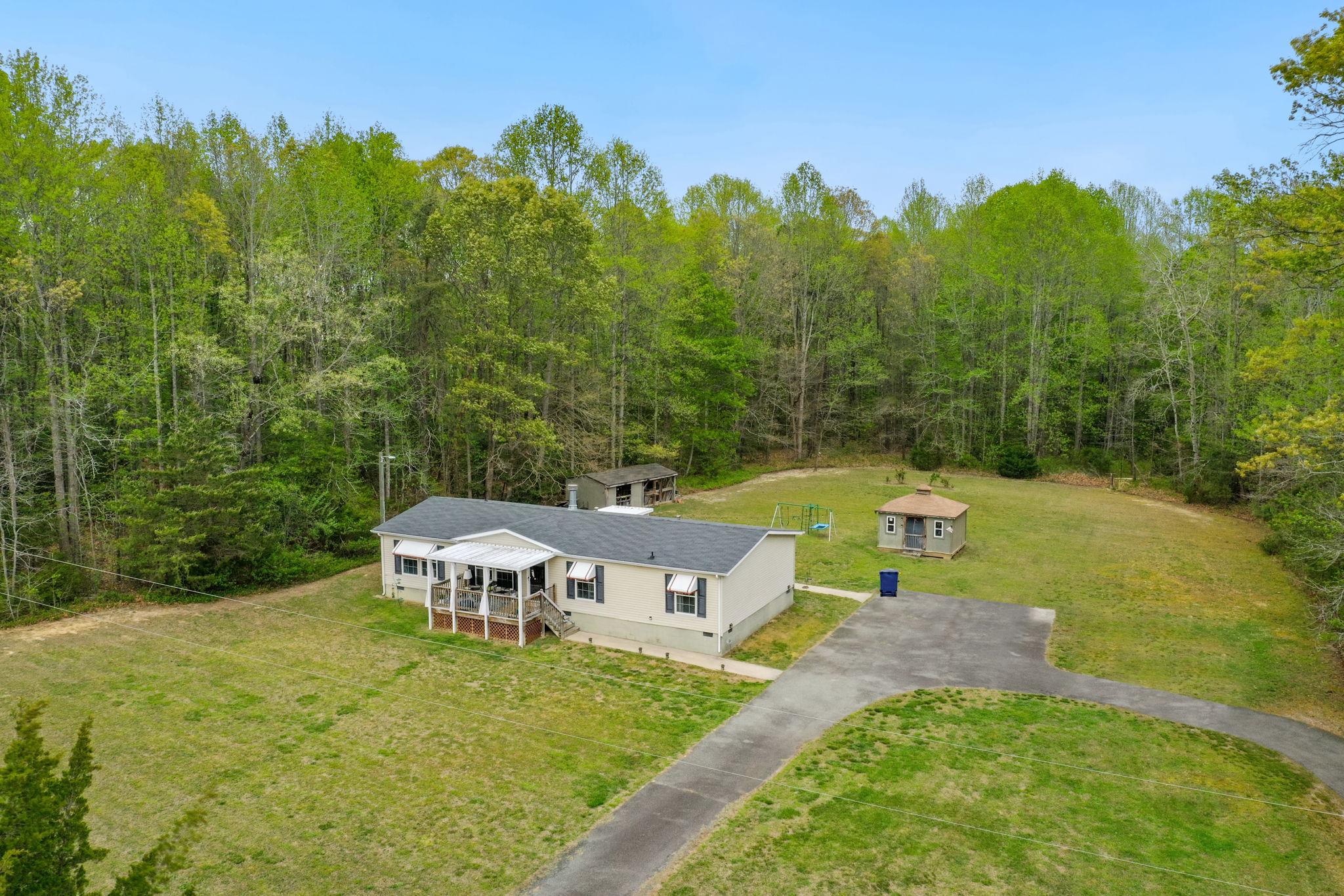 986 Lewis Level Road Tappahannock, VA 22560 - Photo 24 of 24 Serene home nestled in lush greenery.