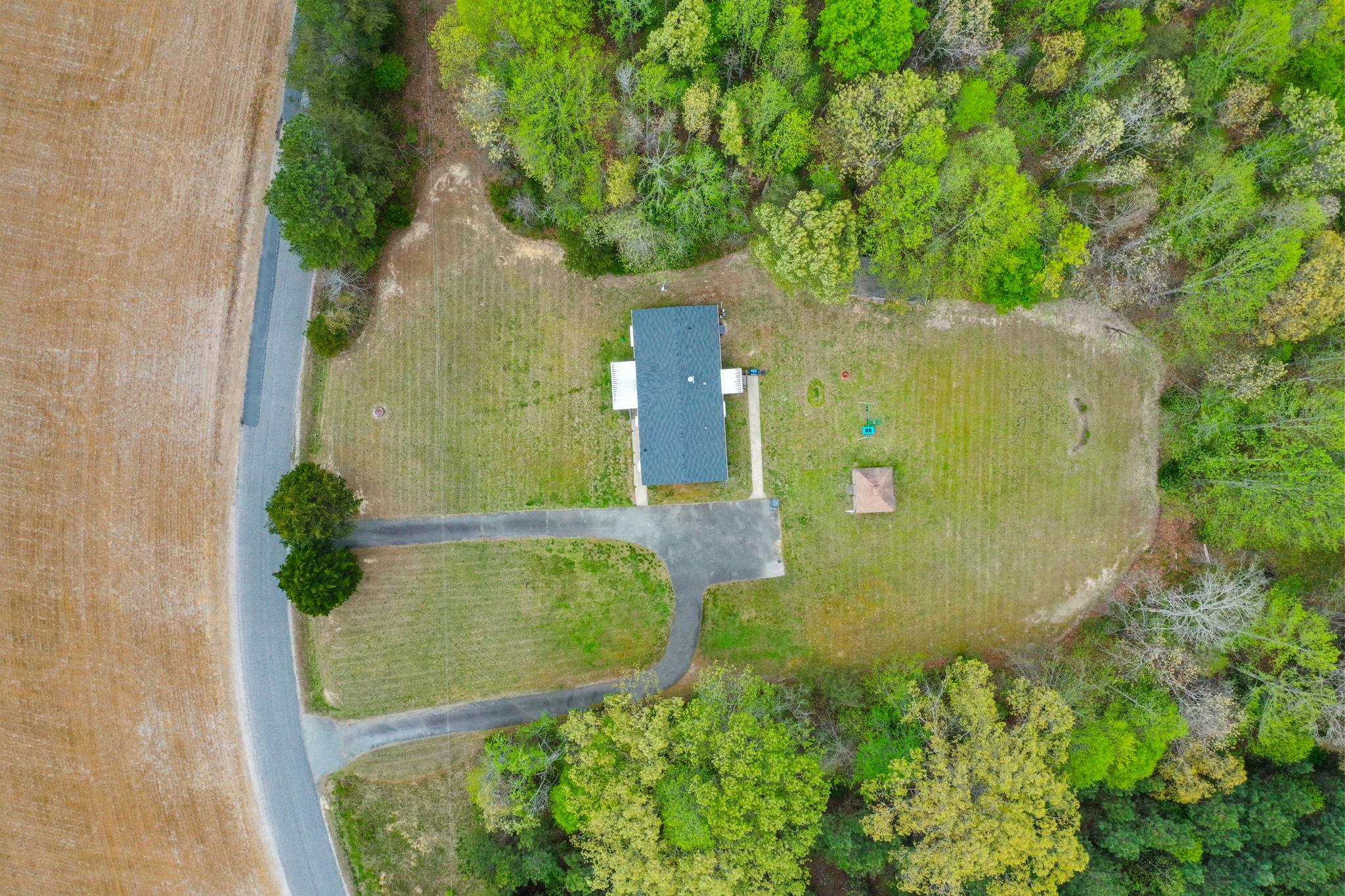 986 Lewis Level Road Tappahannock, VA 22560 - Photo 3 of 24 Serene retreat amidst lush greenery.
