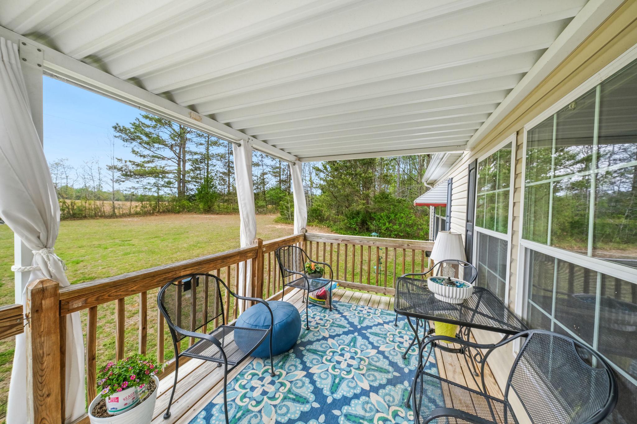986 Lewis Level Road Tappahannock, VA 22560 - Photo 7 of 24 Charming porch with serene views.
