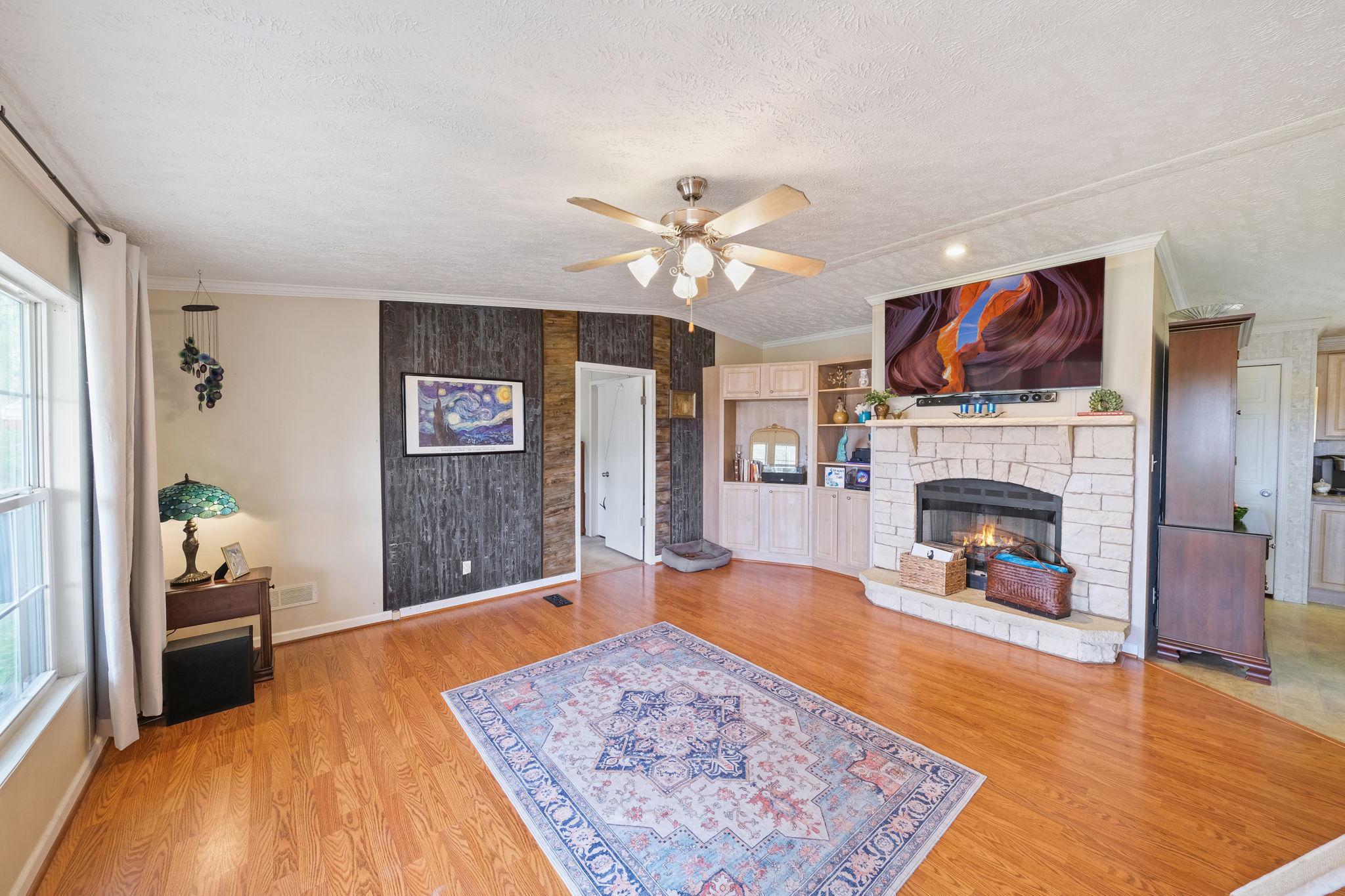 986 Lewis Level Road Tappahannock, VA 22560 - Photo 9 of 24 Inviting space with cozy fireplace charm.