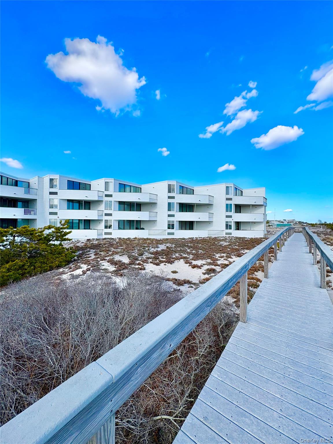 253 Dune Road, Unit 49 Westhampton Beach, NY 11978 - Photo 4 of 20 Boardwalk to the Beach