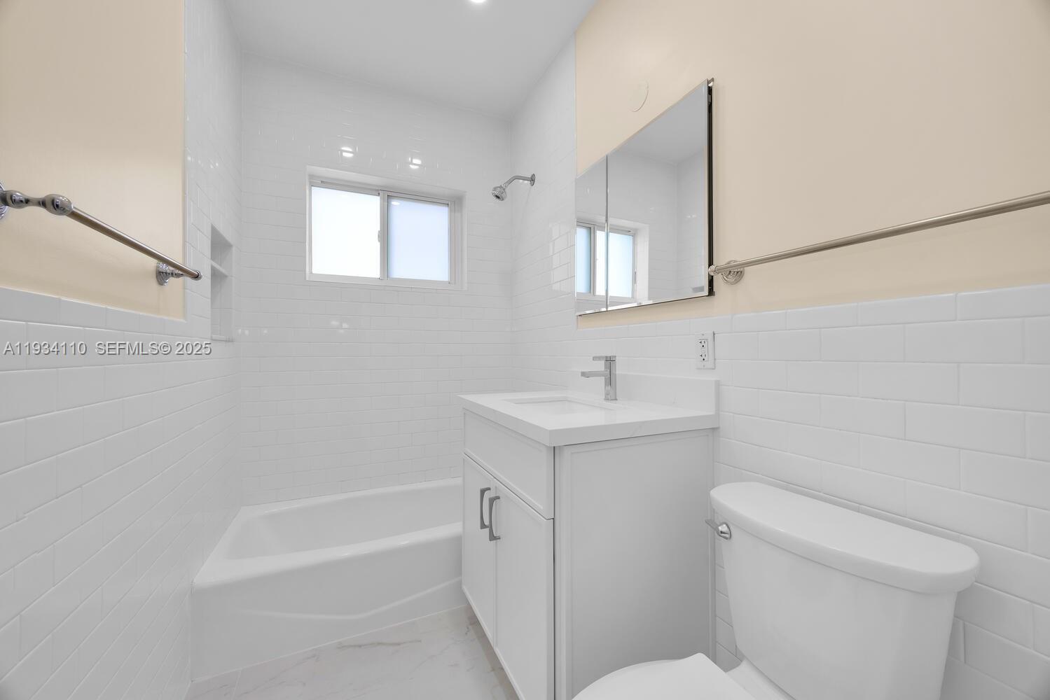 6110 Southwest 79th Street South Miami, FL 33143 - Photo 11 of 22 a bathroom with a sink a toilet and shower