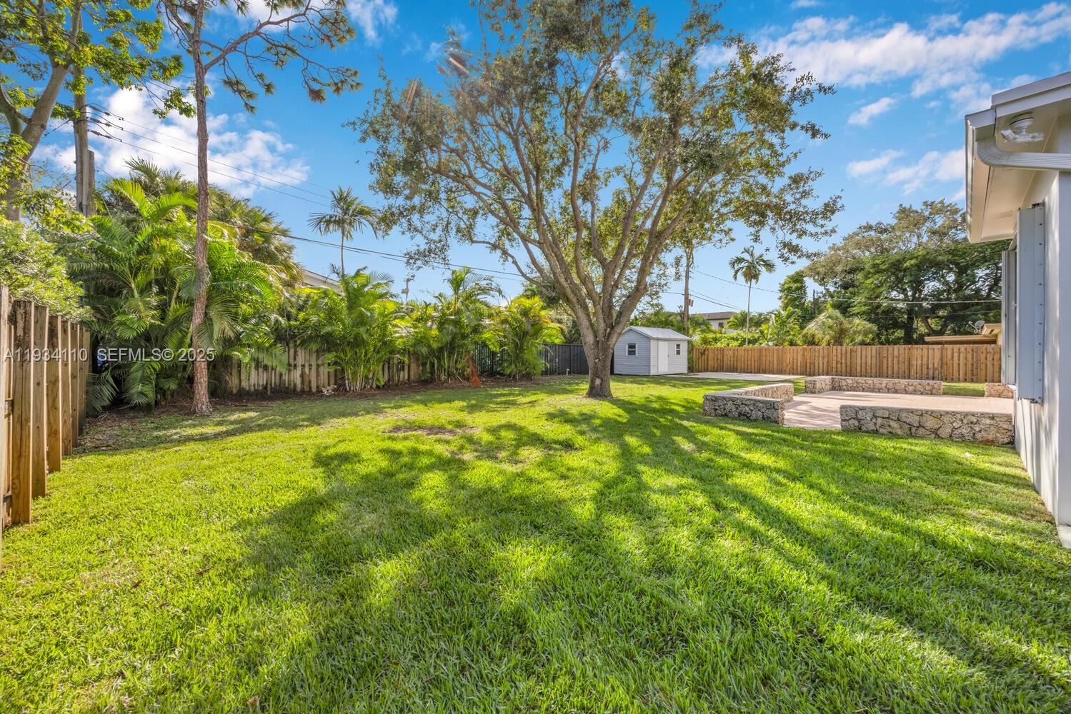 6110 Southwest 79th Street South Miami, FL 33143 - Photo 13 of 22 a view of backyard with tree