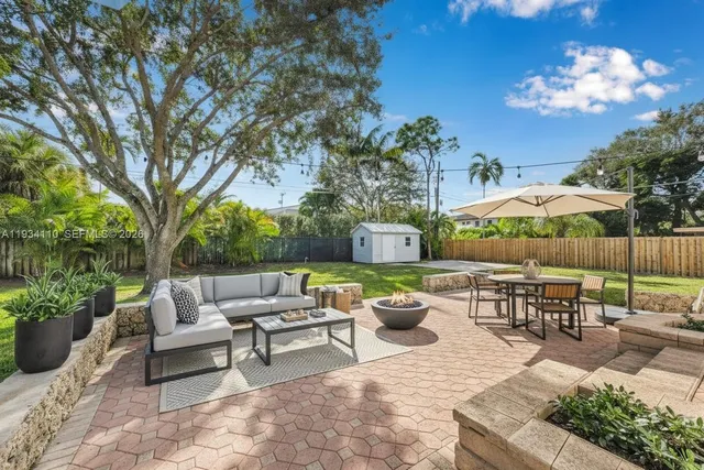 a front view of house with yard and outdoor seating