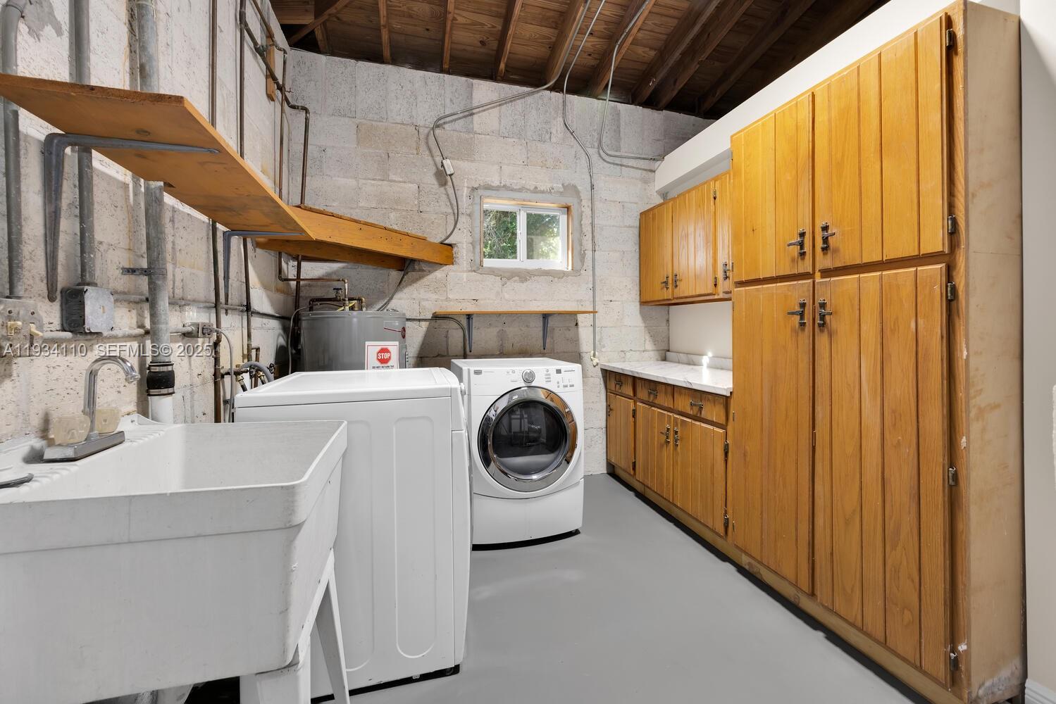 6110 Southwest 79th Street South Miami, FL 33143 - Photo 16 of 22 a utility room with dryer and washer