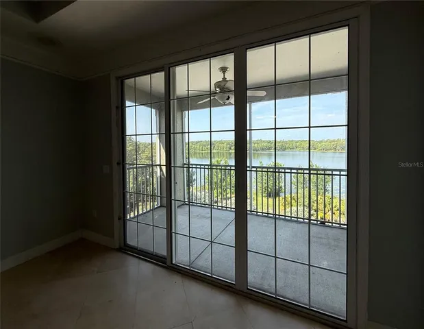 a view of a gate and backyard