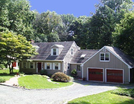 6 Wagon Road Bethel, CT 06801 - Photo 1 of 1 a front view of a house with a yard and garage