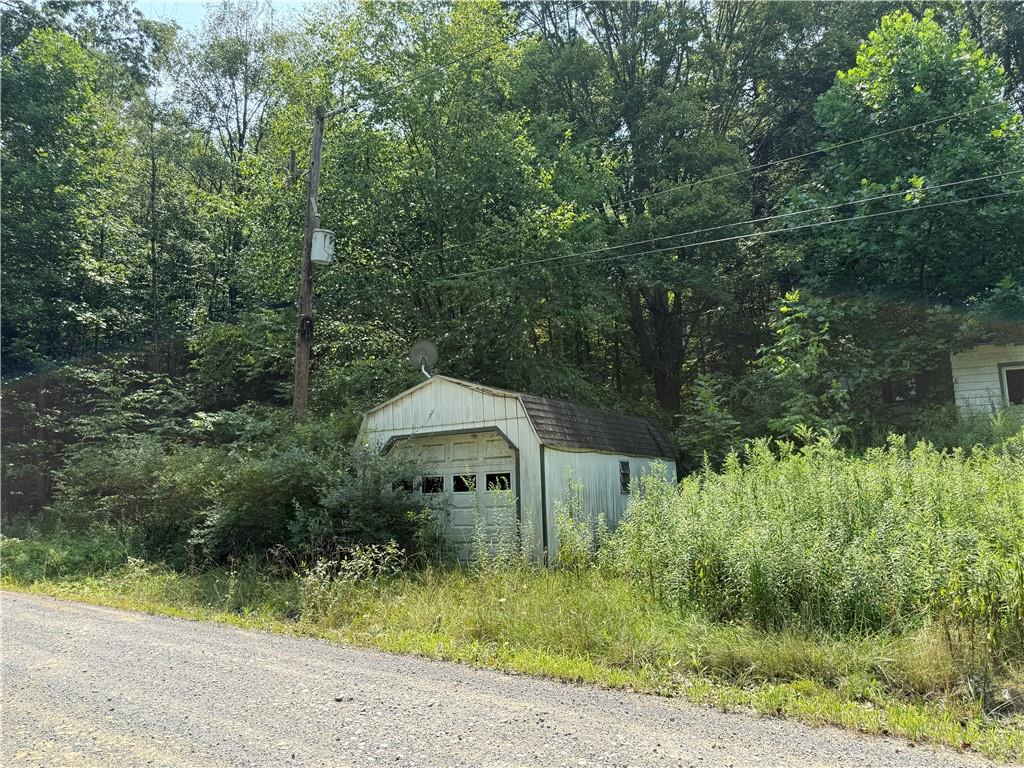 389 West Bellport Road Brookville, PA 15825 - Photo 2 of 5 a front view of a house with a yard