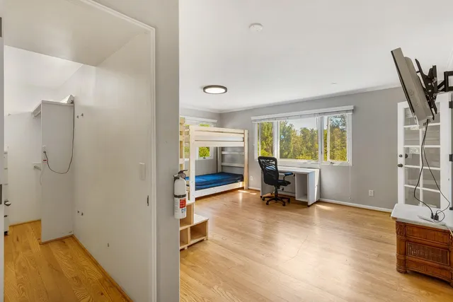 a spacious bathroom with double vanity a mirror a double vanity sinks and a mirror
