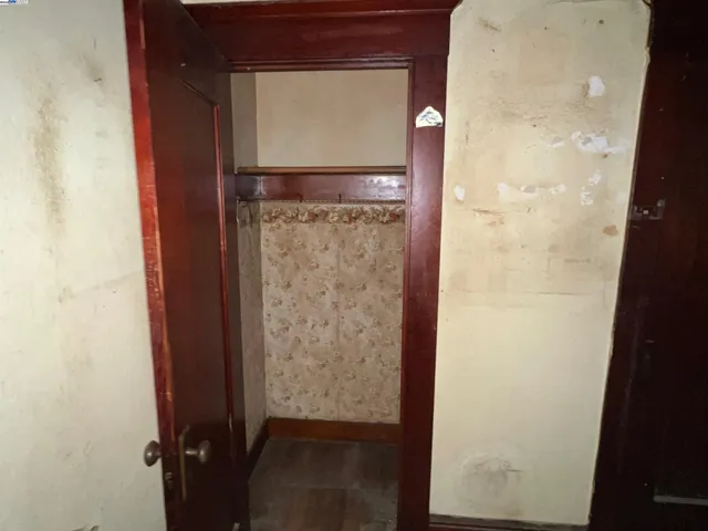 a kitchen with a refrigerator and a stove