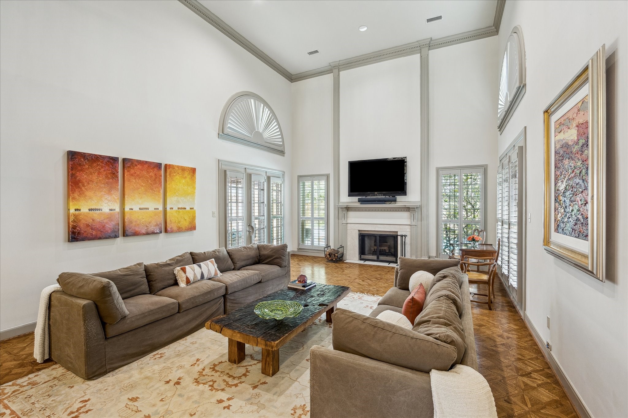 5 Lochtyne Circle Houston, TX 77024 - Photo 11 of 43 a living room with furniture a fireplace and a flat screen tv
