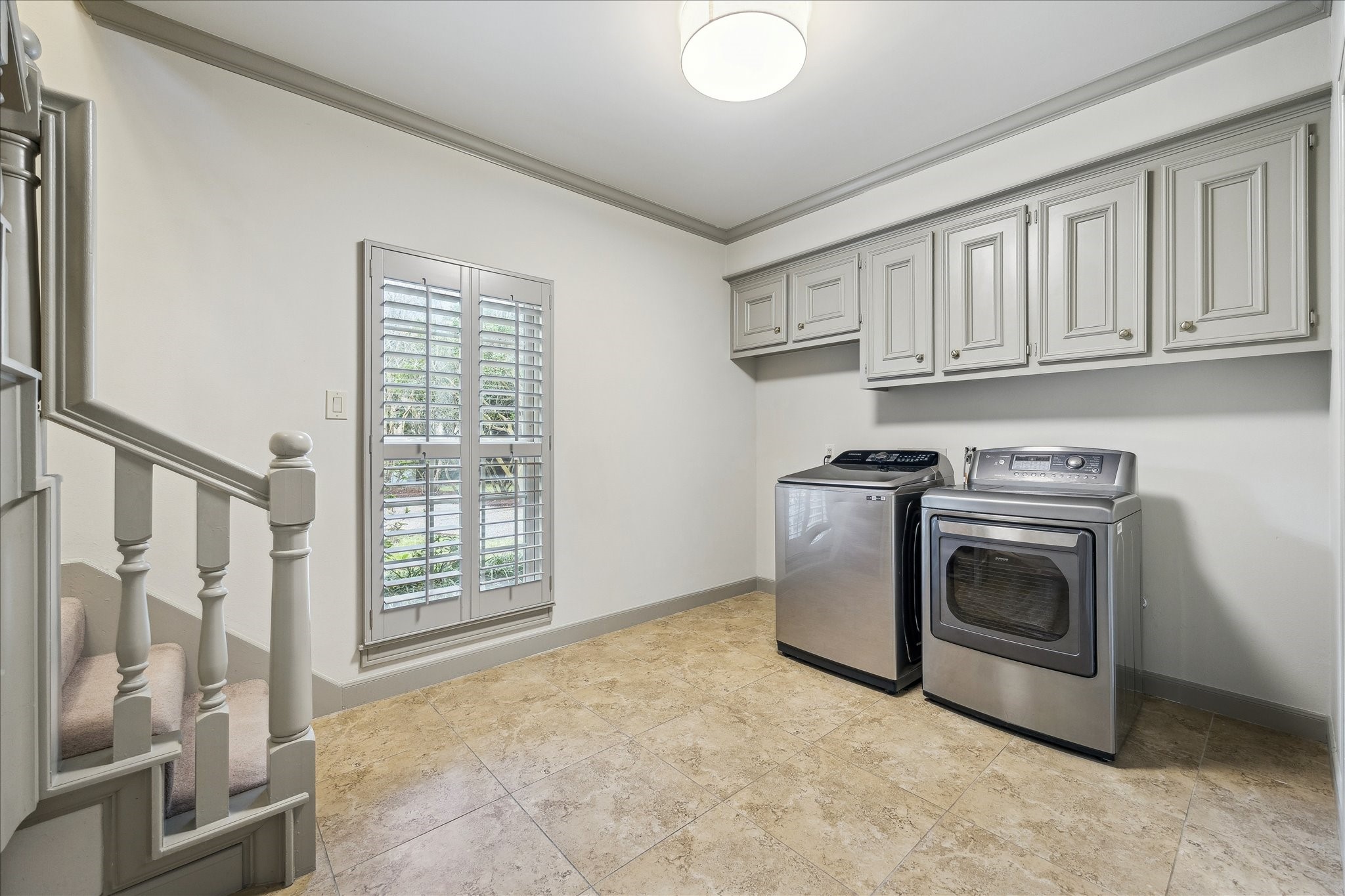5 Lochtyne Circle Houston, TX 77024 - Photo 19 of 43 a kitchen with white cabinets and white appliances